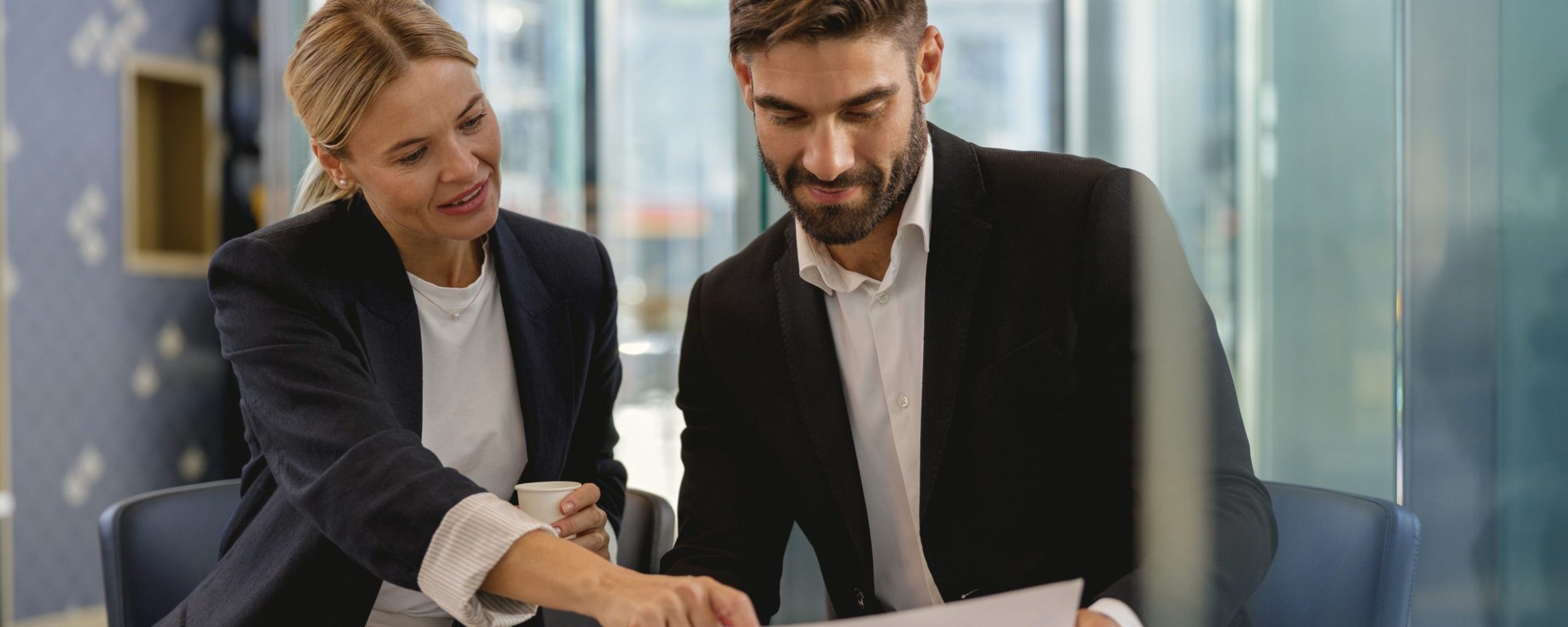 Two business colleagues have meeting in cafe to solve biz issues. Distance work concept